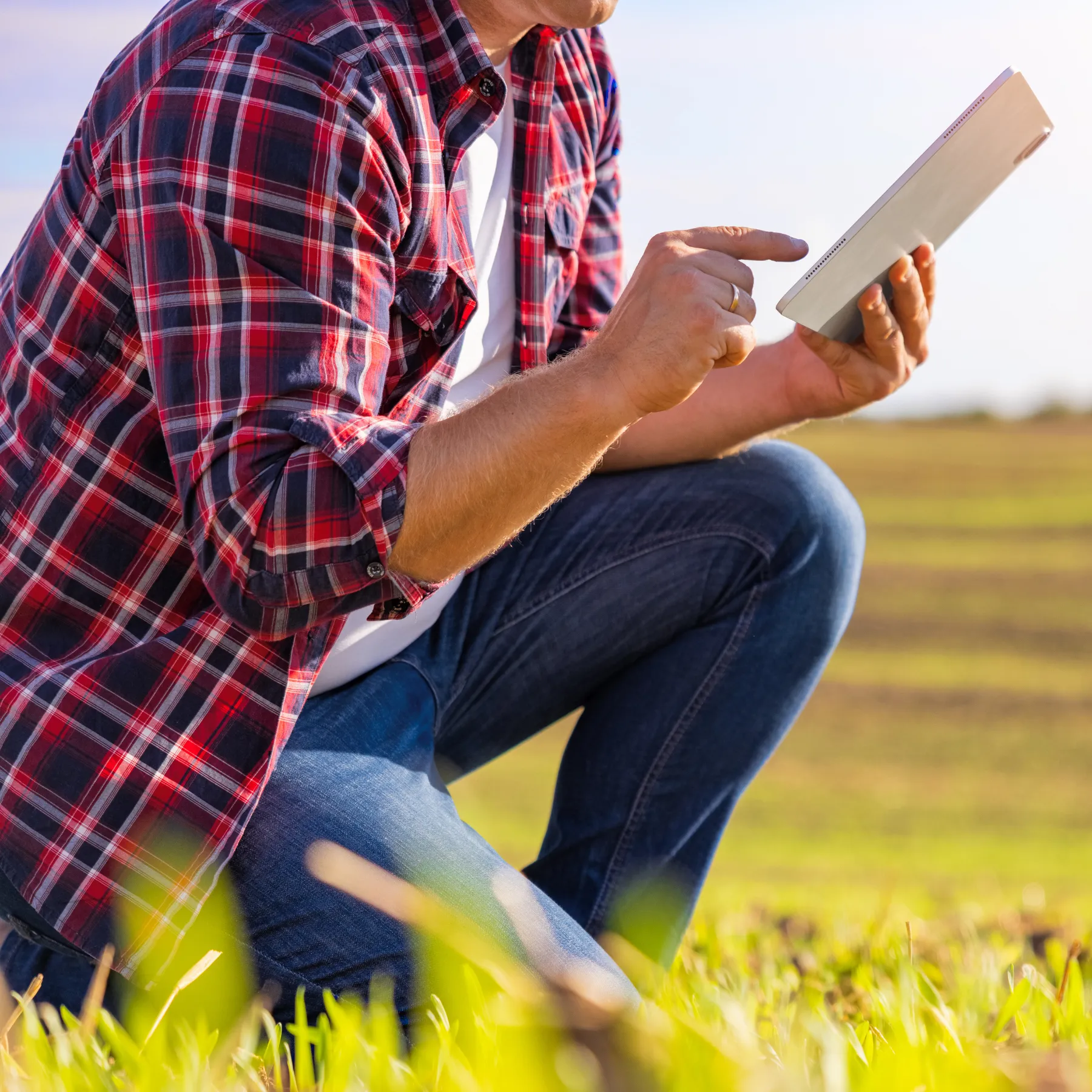 A field worker using naturalForms on a tablet in a remote job site