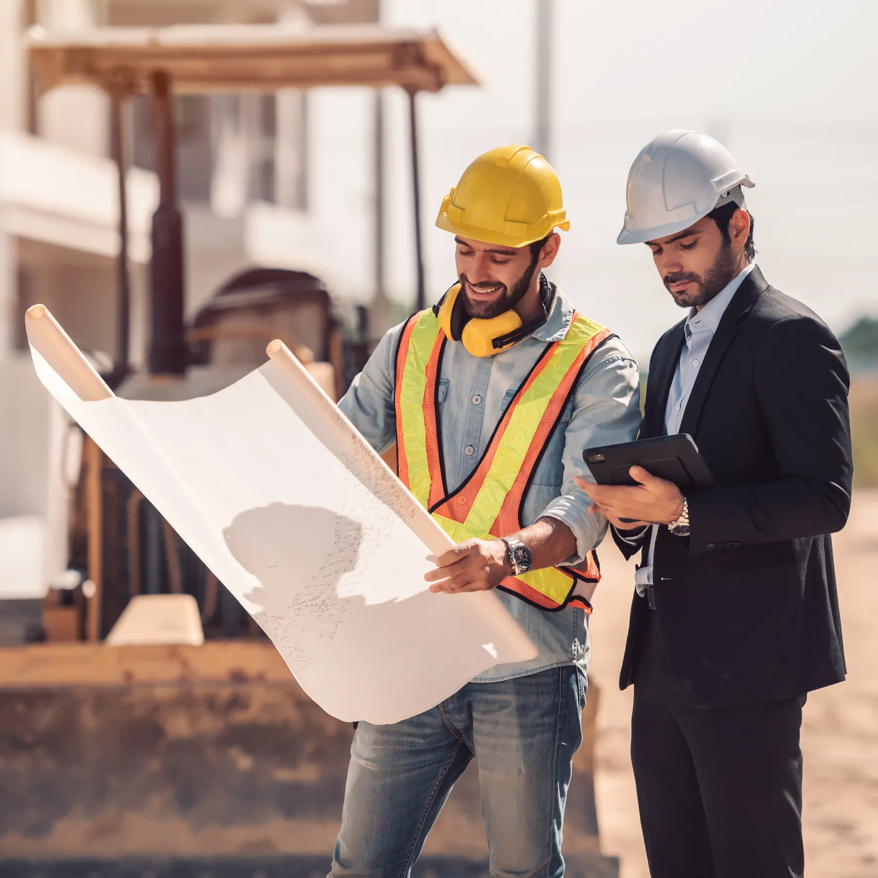 Safety manager handing a tablet to an inspector during an audit